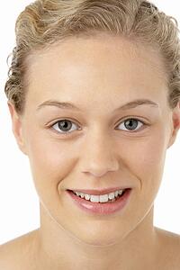 Portrait Of Young Woman Smiling At The Camera