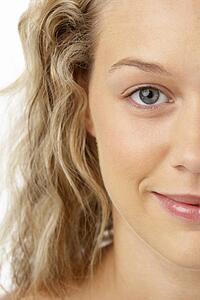 Portrait Of Young Woman Smiling At The Camera