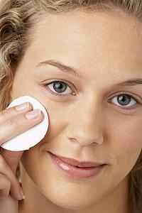 Young Woman Applying Make-Up