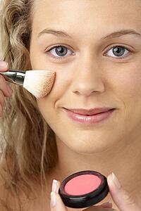 Young Woman Applying Make-Up