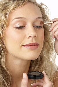 Young Woman Applying Make-Up