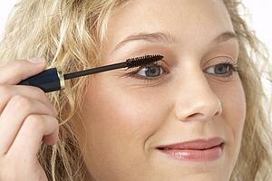 Young Woman Applying Make-Up