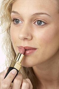 Young Woman Applying Make-Up