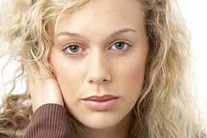 Portrait Of Young Woman Looking At Camera
