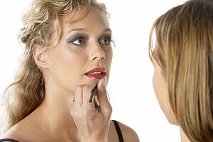 Young Woman Having Her Lipstick Applied