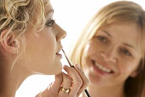 Young Woman Having Her Lipstick Applied