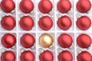 Group Of Red And Gold Christmas Baubles In Box