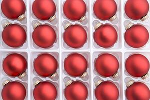Group Of Red Christmas Decorations In Box