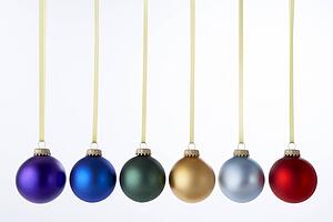 Line Of Christmas Baubles Against White Background