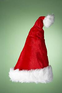 Santa Hat Against Green Background