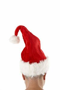 Man Wearing Santa Hat Against White Background