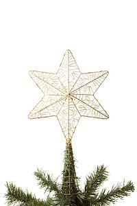 Gold Star On Top Of Christmas Tree Against White Background