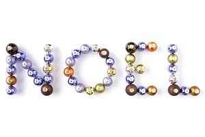 Group Of Coloured Christmas Spelling Noel On White Background