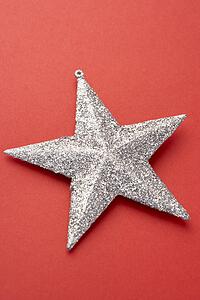 Silver Star Christmas Tree Decoration On Red Background