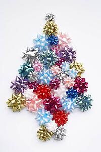 Christmas Tree Made From Gift Bows Against White Background