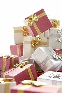 Pile Of Christmas Presents Against White Background