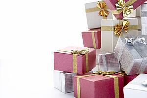 Pile Of Colourful Christmas Presents Against White Background