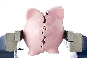 Piggy Bank Split In Two Whilst Being Held In Vice