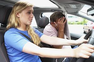 Teenage Girl Taking A Driving Lesson