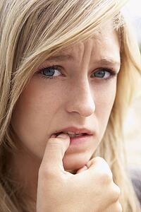 Portrait Of Girl Biting Nails