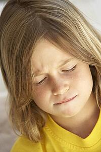 Portrait Of Girl Looking Unhappy