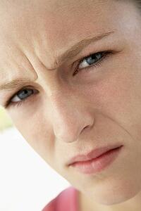 Portrait Of Teenage Girl Frowning