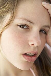 Portrait Of Teenage Girl Looking Frustrated
