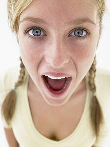 Portrait Of Teenage Girl Looking Shocked