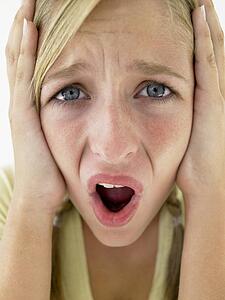 Portrait Of Teenage Girl Screaming