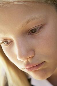 Portrait Of Girl Looking Unhappy