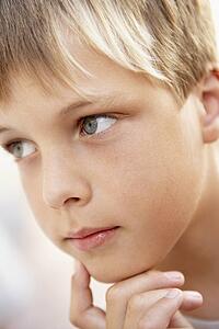 Portrait Of Boy Looking Pensive