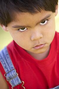 Portrait Of Young Boy Sulking
