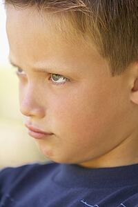 Portrait Of Boy Pouting