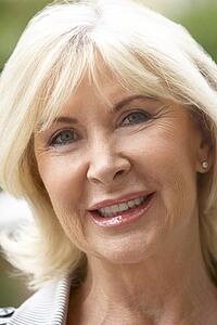 Portrait Of Senior Woman Smiling At The Camera