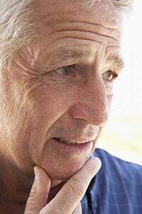 Portrait Of Middle Aged Man Looking Worried