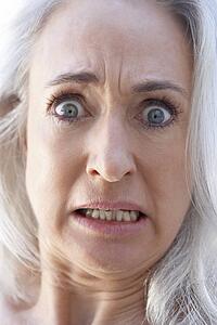 Portrait Of Senior Woman Looking Shocked