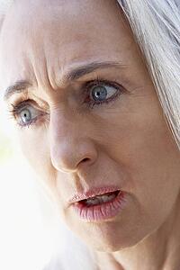 Portrait Of Senior Woman Looking Upset