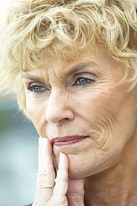 Senior Woman Lost In Thought