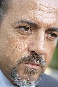 Portrait Of Middle Aged Man Looking Serious