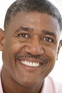 Portrait Of Middle Aged Man Smiling At The Camera