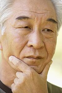 Portrait Of Senior Man Looking Anxious