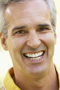 Portrait Of Middle Aged Man Smiling At The Camera