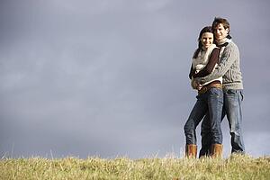 Couple Embracing In Park