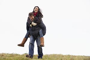 Man Giving His Wife Piggy Back Ride