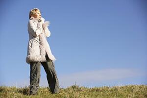 Senior Woman Standing In Park