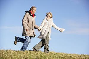 Senior Couple Running In The Park