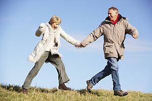 Senior Couple Running In The Park