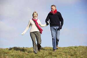 Senior Couple Running In The Park