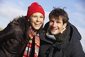 Couple Laughing In The Park Together