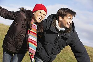Couple Laughing In The Park Together
